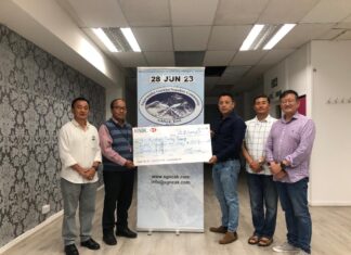 Community hands over £801 to the bereaved family of late Sadikshya Tamang
